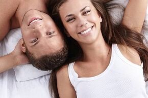 a woman in bed with a man who has increased potency naturally